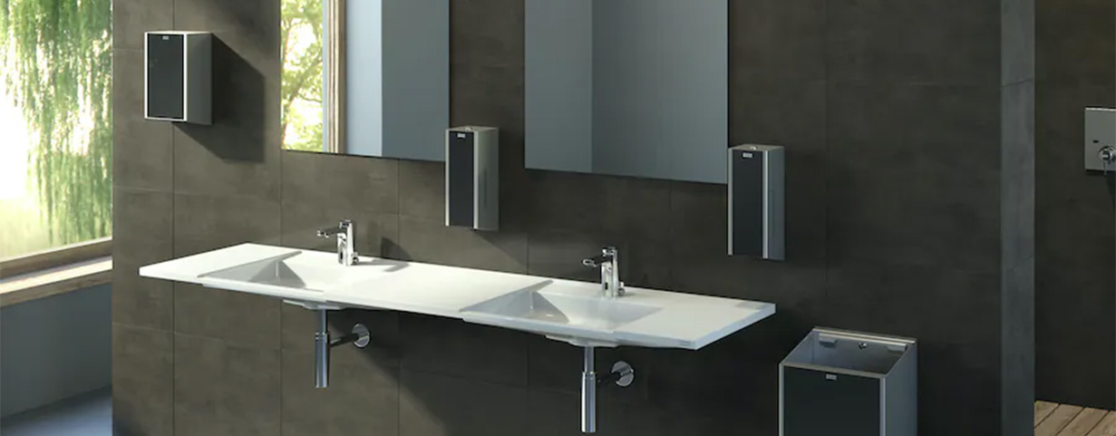 What products should I use to clean my stainless steel washroom dispensers?