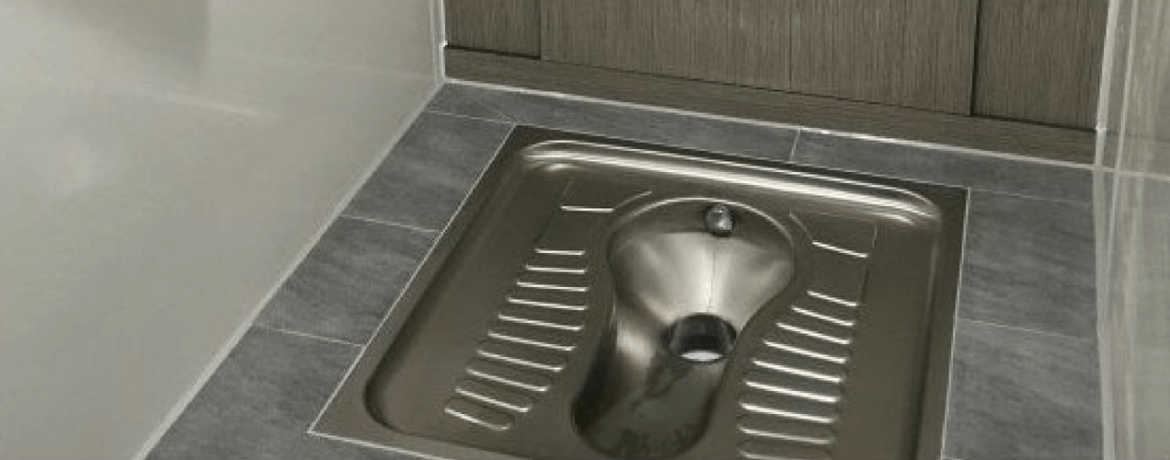 Squat toilet outlet