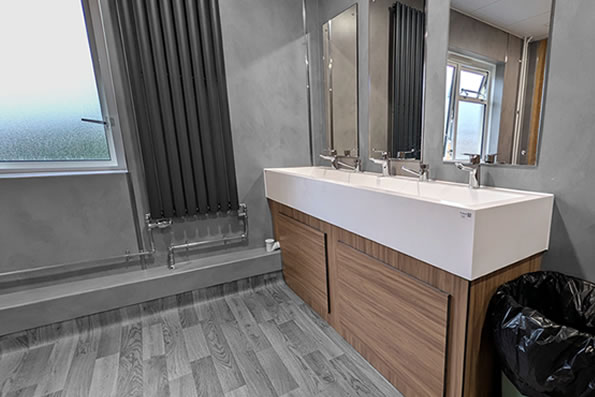Corian Wash Trough with Hansgrohe Logis Single Lever Basin Mixer Taps. 