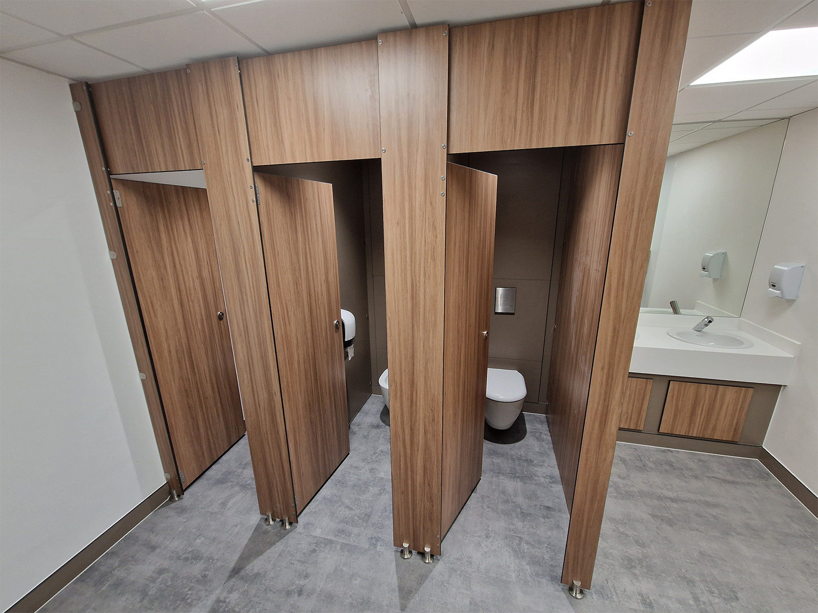 SGL toilet cubicles, wall hung toilets, and concealed cisterns